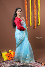 Load image into Gallery viewer, Sky Blue Organza Saree with Silver Zari Border – Ethereal Elegance
