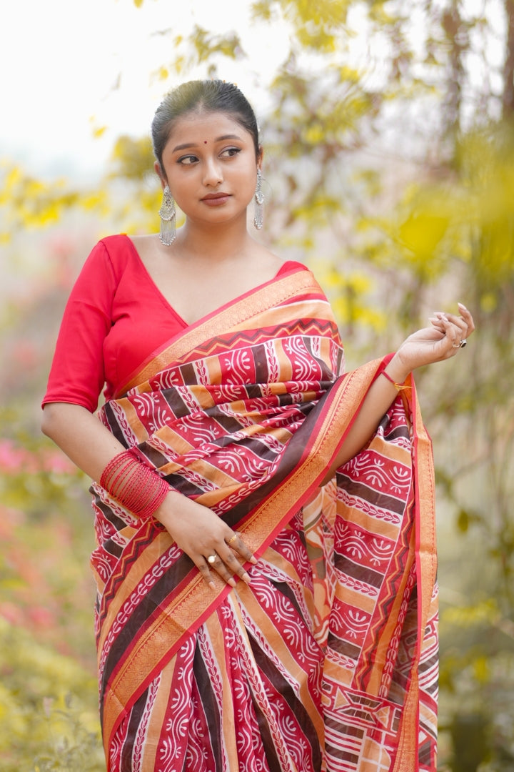 Elegant Red Malbari Silk Saree with Traditional Tribal Patterns