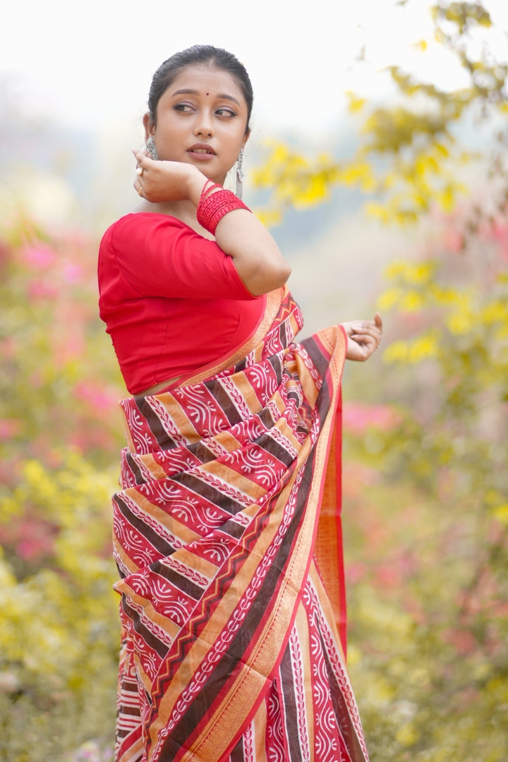 Elegant Red Malbari Silk Saree with Traditional Tribal Patterns